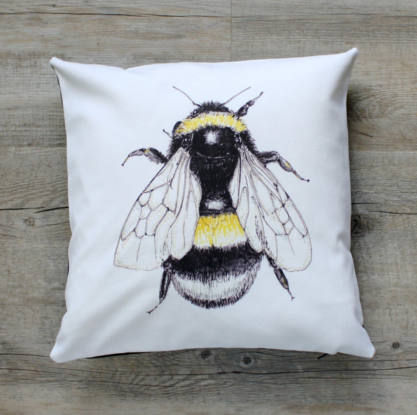 bee cushion on white material